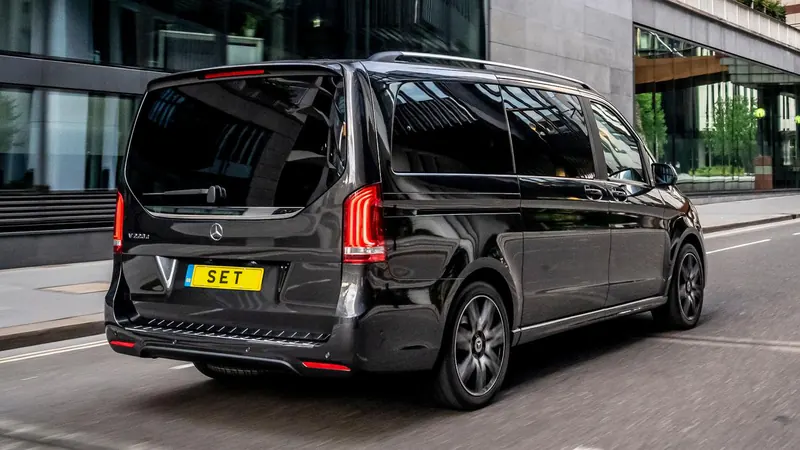 Rear of a black Mercedes V Class with SET number plate